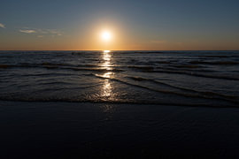 Sunset on Kijkduin beach by Merijn Loch