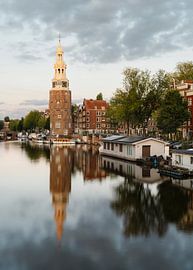 Montelbaan Tower, canal and old houses in Amsterdam, the Netherlands.