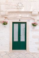 Green door with pink flowers - Locorotondo (Puglia - Italy)