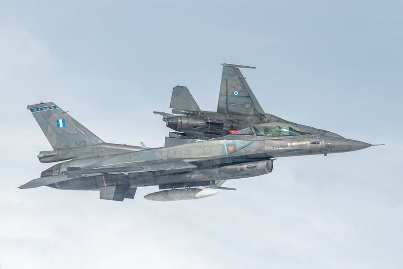 Two General Dynamics F-16s of the Greek Air Force air to air photographed in Belgian airspace. by Jaap van den Berg