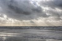 Bundles of sun rays between the cloudy sky, Egmond