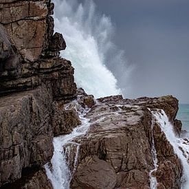 Breaking waves on rocks. by Roelinda Tip