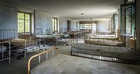 Beds in an abandoned hospital by Inge van den Brande thumbnail