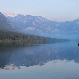 Lone fisherman on Lake Bohinj by OCEANVOLTA