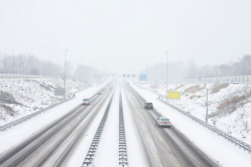 Snowstorm on the A9 near Amsterdam in the Netherlands in winter by Eye on You
