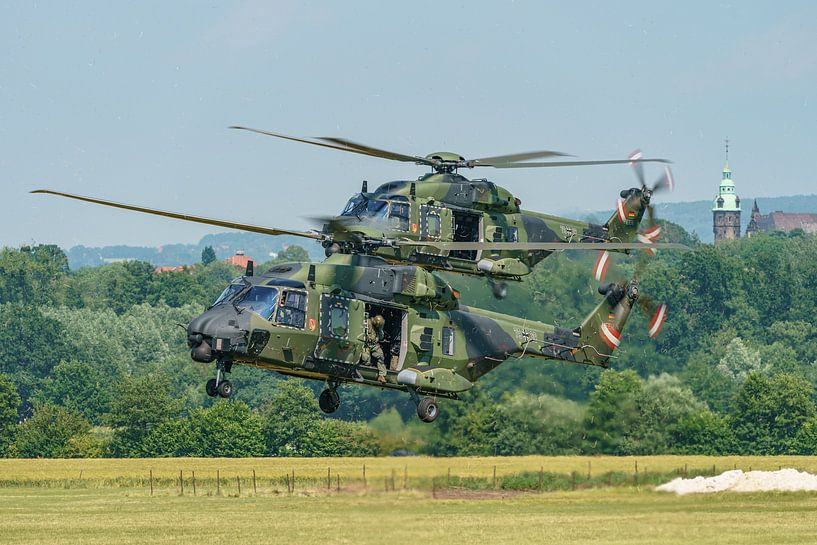 Landing of two German NH-90 helicopters. by Jaap van den Berg