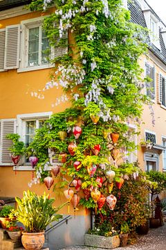 Lanterns on a house wall in Nonnenhorn by Andreas Nägeli