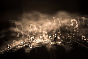 Wassertropfen auf einem Fussel mit Bokeh in Form einer Musiknote