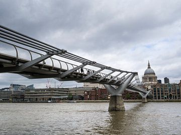 View of the Millennium Bridge over the River Thames with the dome of St. Paul's Cathedral in the bac