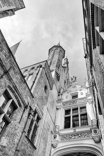 Bruges Belgium gate and building of the Blinde Ezelstraat in black and white