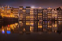 Moon rise at the Damrak in Amsterdam