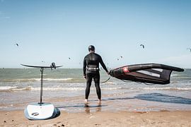 Surfer on the beach by Jack Tummers