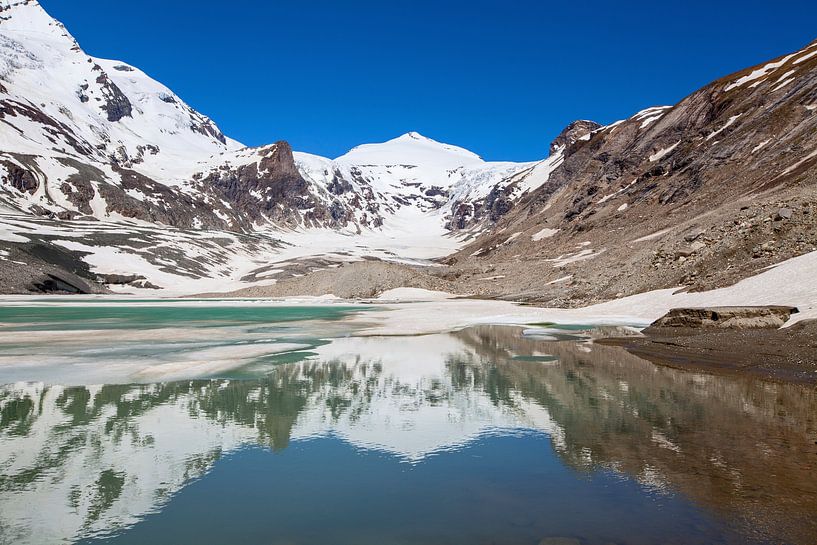 The Johannisberg is reflected in Lake Sandersee by Christa Kramer