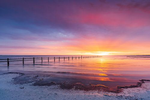 Sunrise at the emergency harbour Darßer Ort