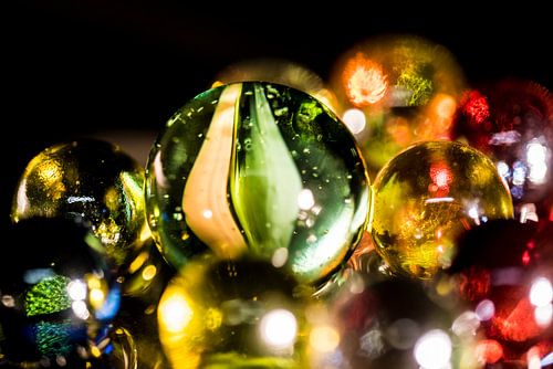 Reflected coloured glass beads on black background