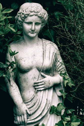 Weathered art statue woman