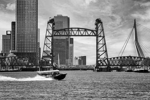 A water taxi passes 3 Rotterdam bridges
