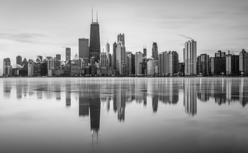 The Chicago skyline in black and white, with Lake Michigan frozen over