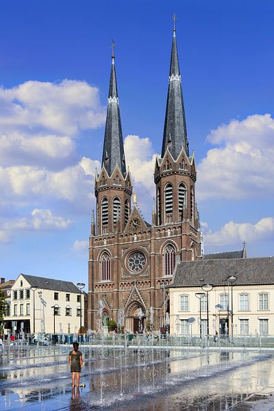 Water jets on a square in front of Saint Joseph church by Tony Vingerhoets