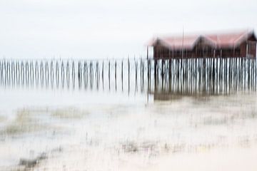 House on stilts on the beach by Imaginative