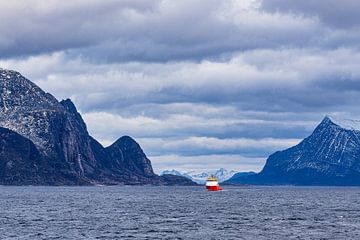 Mountains, rocks and ship in winter near Ørnes in Norway by Rico Ködder