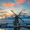 Windmolen (hoop doet leven) in een winters landschap van eric van der eijk