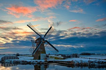 Windmill in a winter landscape by eric van der eijk