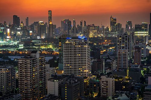 Sunset against the Bangkok skyline by Jelle Dobma