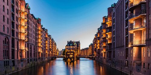 The Speicherstadt in Hamburg at night by Werner Dieterich