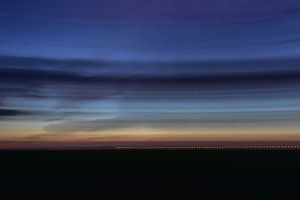 Verschwindender Zug in einer Abendlandschaft / A disappearing train in the evening