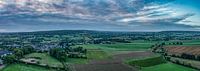 Dronepanorama van een bewolkte zonsopkomst bij Epen In Zuid-Limburg van John Kreukniet thumbnail