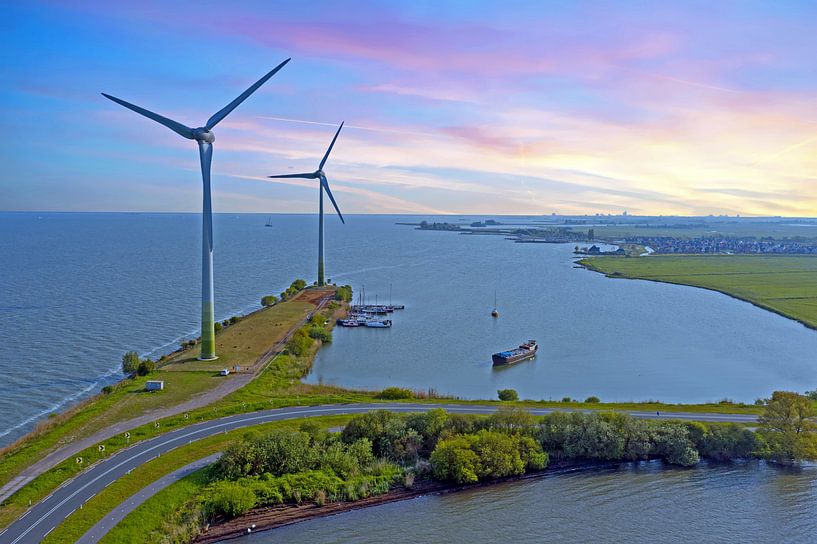 Wind turbines along the IJsselmeer near Durgerdam at sunset by Eye on You
