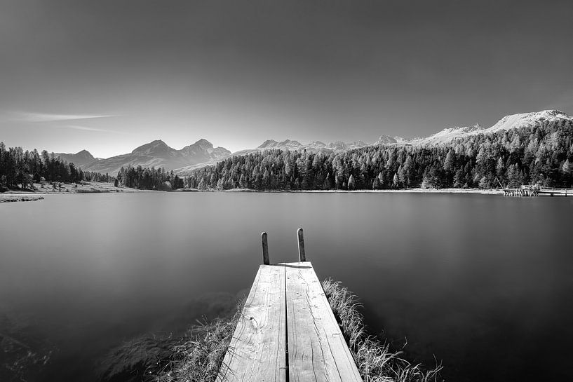 Footbridge at the lake in the Engadine in Switzerland in black and white. by Manfred Voss, Black-White Photography