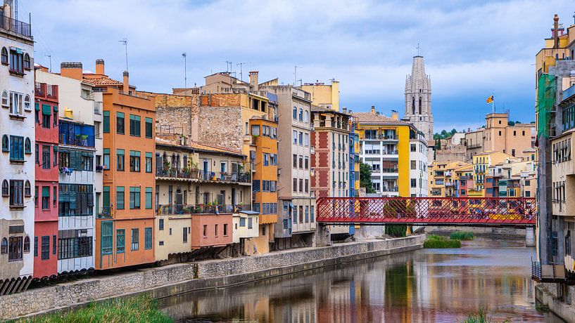 Colored houses on the waterfront in Girona, Spain by Jessica Lokker