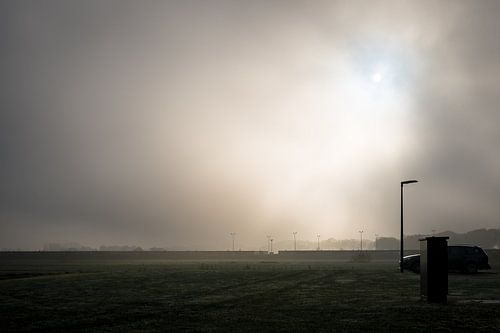 Fog and sun over the landscape an village