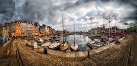 Honfleur Harbor Under a Cloudy Sky With Sailboats Docked by Luc V. de Zeeuw