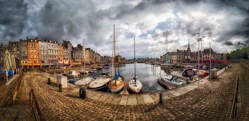 Honfleur Harbor Under a Cloudy Sky With Sailboats Docked