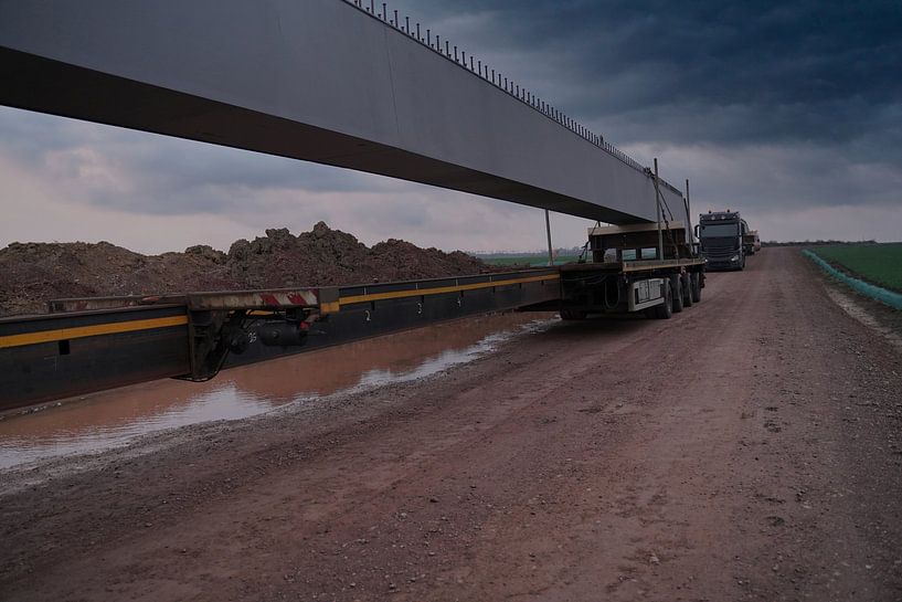 Arrival of heavy goods vehicles with bridge girders by Babetts Bildergalerie