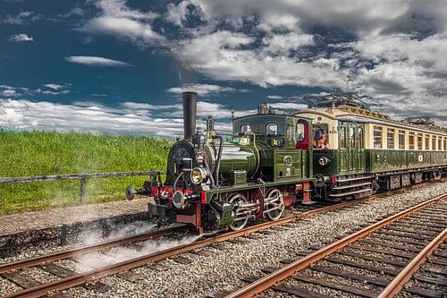 Steam train between Medemblik and Hoorn steam blowing down the track
