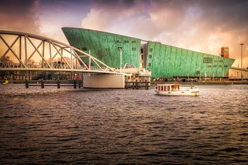 Boat for Neme with colourful clouds during sunset in Amsterdam Oosterdok