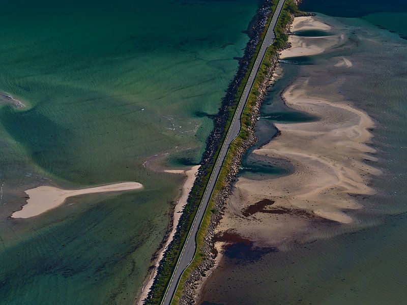 Bird's eye view of a road on a dam crossing the fjord Grunnførfjorden on the coast of Lofoten, Norwa by Timon Schneider