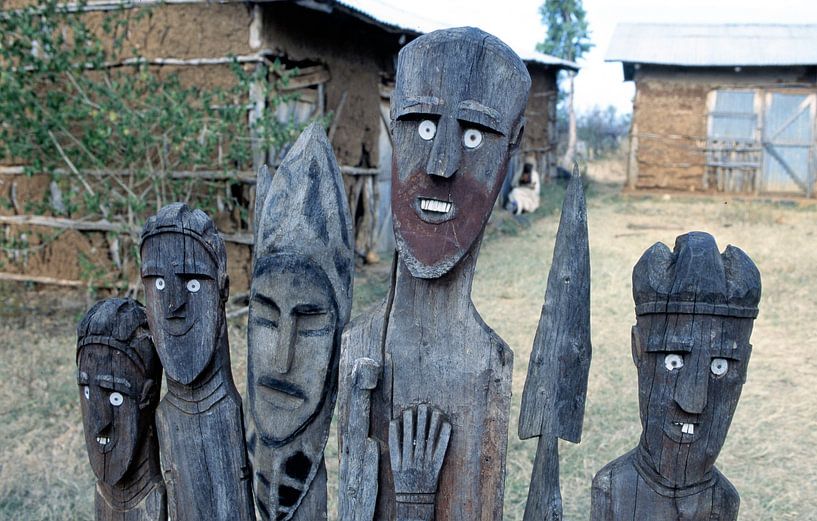 Wooden statues at the entrance of an Ethiopian tribe by Ignacio Genzo