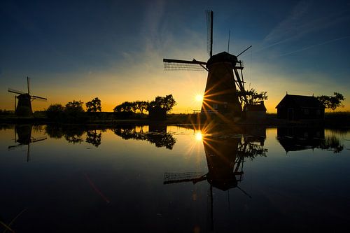 Windmills reflection by Jim Looise