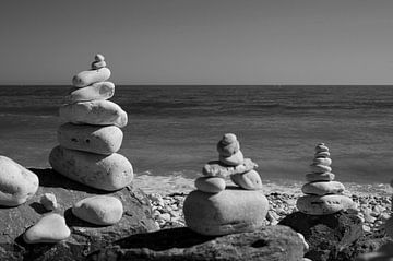 Stacked pebbles in Normandy by Peter Bartelings