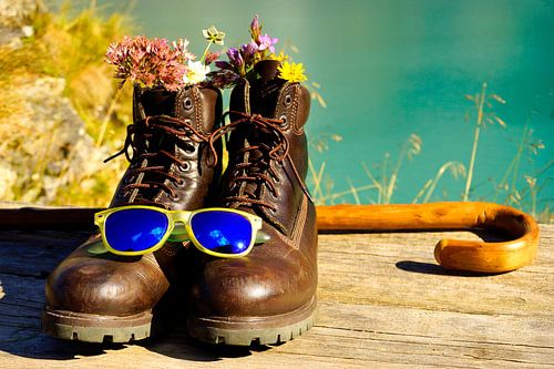 Hiking boots and walking stick