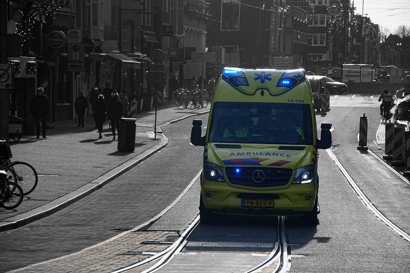 Ambulance with flashing lights by Agnes Koning