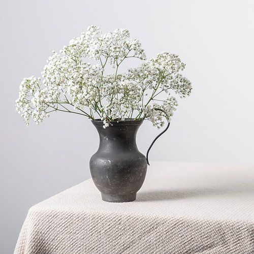 Pewter vase with gypsophilia