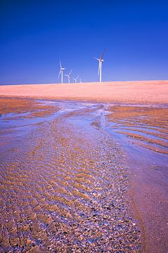 Wind turbines on the beach by Leon Okkenburg