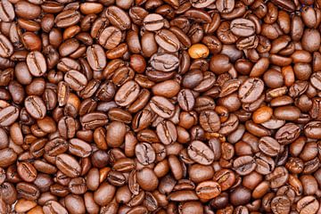 Gebrande koffiebonen creëren een aromatische getextureerde achtergrond van de-nue-pic