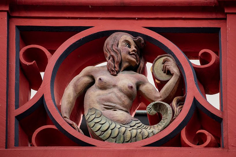 Ballustrade with sculpture on the roof of the Basel Town Hall in Switzerland by Joost Adriaanse
